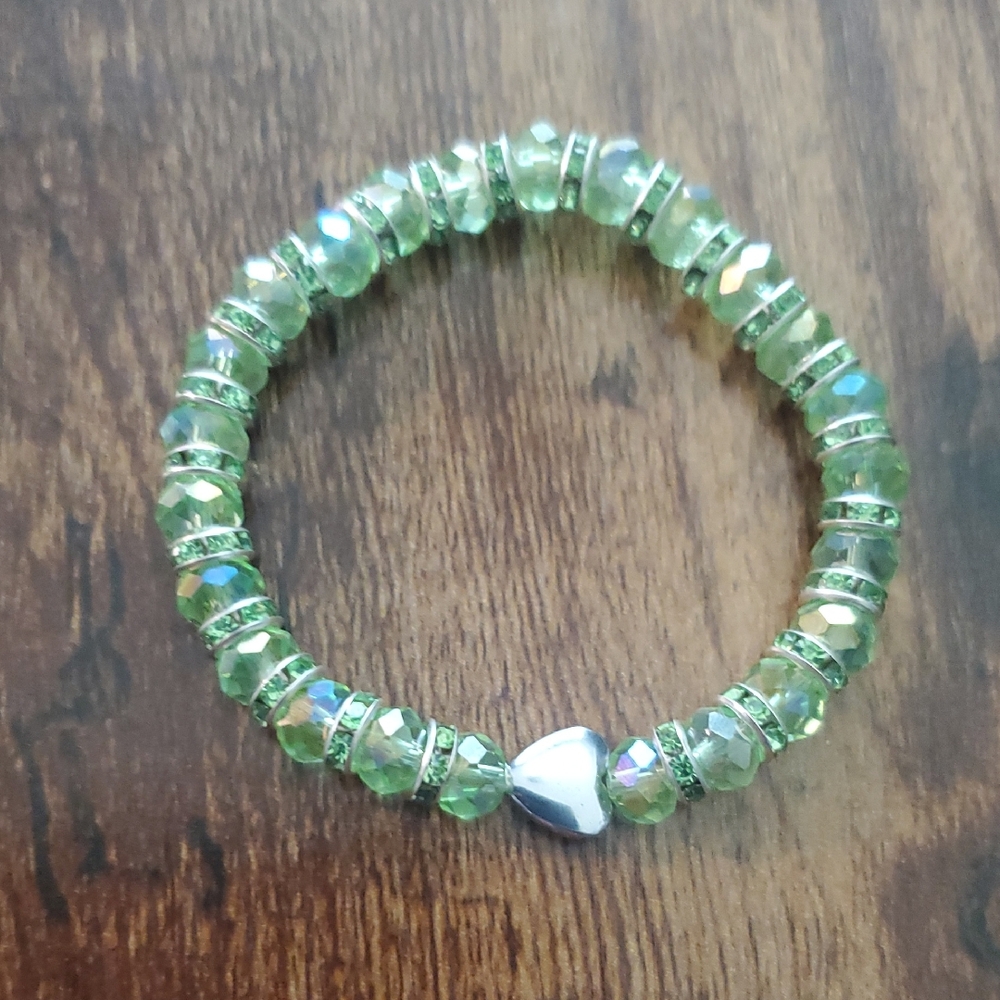 Handmade by my daughter. Green Beaded Bracelet with Silver Heart Charm